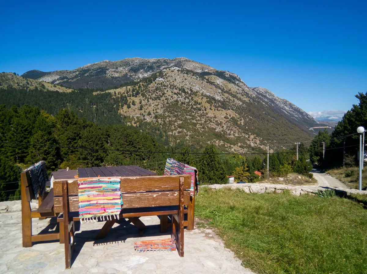 Wooden bench with an outdoor table overlooking Rujište mountain
