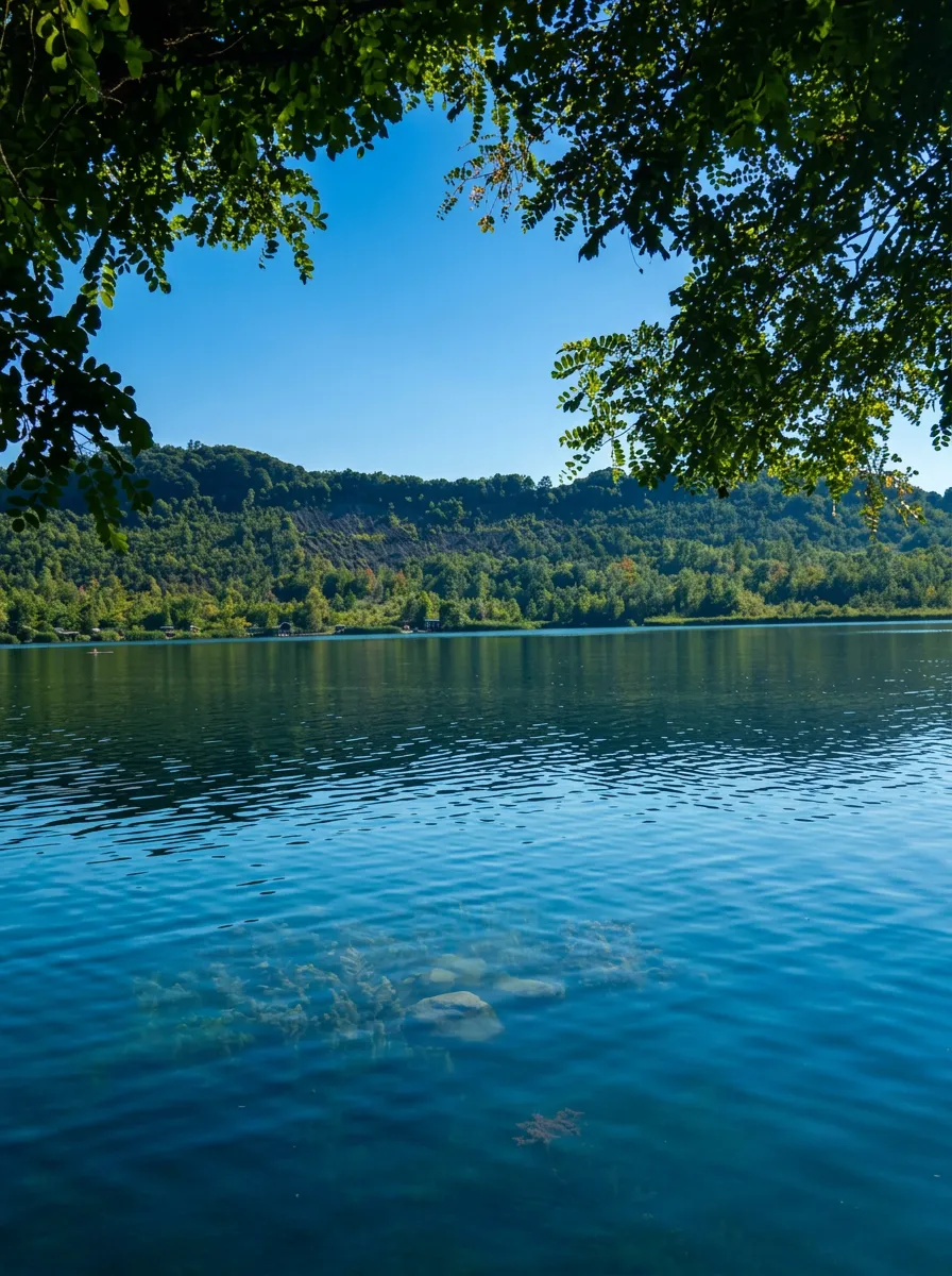 Clear water and the wooded shore of Kop Plane-Šići Lake 