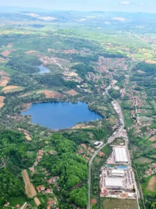 Aerial view of Kop Plane-Šići Lake and the surrounding settlement
