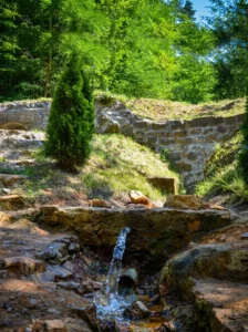 A stone spring of clean water in the natural setting of Guber picnic area