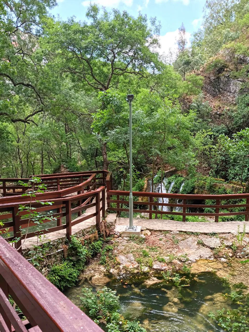 Wooden walking path and footbridge for visitors near the source of the Tihaljina River