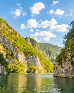 Green landscape of the Drina River canyon with rocks and a clear sky