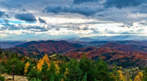 Wide view of Tvrtkovac mountain peaks under a cloudy sky