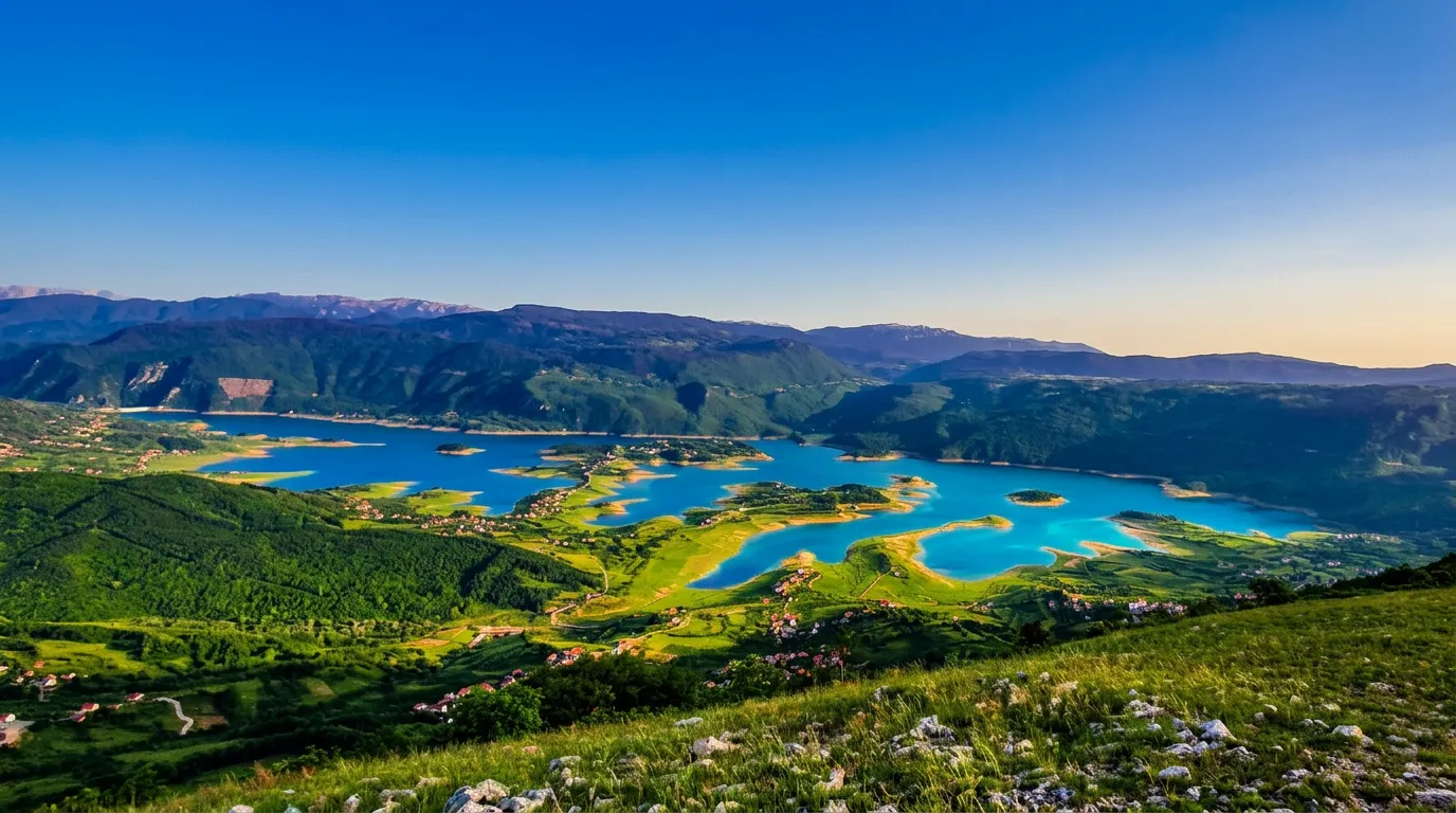 Beautiful landscape of the lake and hills in the late afternoon from the Draševo viewpoint