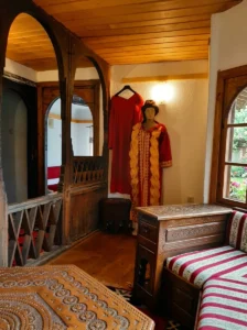 Display of traditional folk costume and furniture inside Eminagića konak