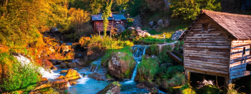 Krupa na Vrbasu Stari drveni mlinovi uz slapove rijeke Vrbas u Krupi na Vrbasu, okruženi jesenskim šarenim zelenilom